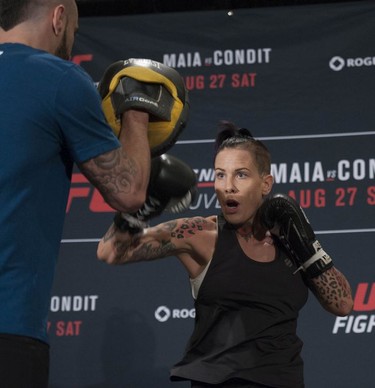 UFC fighter Bec Rawlings works out with Adrian Rodriguez at the Hyatt Regency hotel in Vancouver on Thursday. Rawlings is on the main card of UFC on FOX 21 on Saturday at Rogers Arena, taking on Paige VanZant in a women’s strawweight bout.