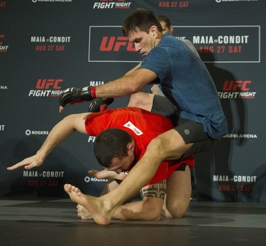 UFC fighter Demian Maia gets on top of Luiz Cane at the Hyatt Regency hotel in Vancouver on Thursday. Maia takes on Carlos Condit in the headline bout of UFC on FOX 21 on Saturday at Rogers Arena.