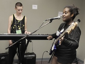 Keyboardist Rozz Barrett plays with bassist Perla Galvan during Girls Rock Camp, a yearly course for girls aged 8-18.