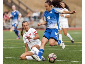 Simon Fraser's Teagan Sorokan (left) slows the progress of UBC's Shayla Chorney during first women's soccer clash between the crosstown rivals in eight seasons Saturday atop Burnaby Mountain. UBC scored late to earn a 1-1 draw. (Wilson Wong, UBC athletics) [PNG Merlin Archive]