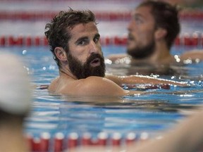 Benoit Huot (centre) is shown in the pool during a media availability as the Canadian Paralympic Swim Team for Rio 2016 is announced in Toronto on Monday, August 29, 2016. Huot hesitates at the mention of retirement. As the veteran Canadian swimmer heads into his fifth Paralympics, he isn&#039;t trying to think too much about how many Games he may have left, but admits he&#039;s going to savour every moment in Brazil. THE CANADIAN PRESS/Chris Young