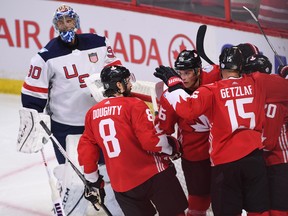 Team Canada celebrates a third period goal by Jonathan Tavares as Team USA goaltender Ben Bishop looks on during pre-tournament World Cup of Hockey action in Ottawa on Saturday, Sept. 10, 2016. THE CANADIAN PRESS/Sean Kilpatrick ORG XMIT: SKP109