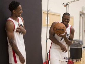 Toronto Raptors&#039; DeMar DeRozan (left) and Kyle Lowry share a joke as they pose for a photoshoot during a media day for the team in Toronto on Monday September 26, 2016. THE CANADIAN PRESS/Chris Young