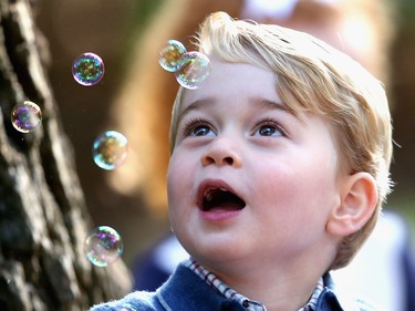 Prince George of Cambridge plays with bubbles at a children's party for Military families during the Royal Tour of Canada on September 29, 2016 in Carcross, Canada. Prince William, Duke of Cambridge, Catherine, Duchess of Cambridge, Prince George and Princess Charlotte are visiting Canada as part of an eight day visit to the country taking in areas such as Bella Bella, Whitehorse and Kelowna .