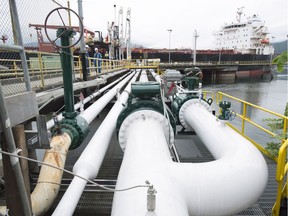 A tanker receives a load of oil at the Westridge loading dock in Burnaby, the western terminus of Kinder Morgan's Trans Mountain pipeline. A proposed expansion of the pipeline is proving divisive among voters, making many politicians indecisive on the issue.