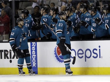 San Jose Sharks' Barclay Goodrow (23) celebrates his goal with teammates during the second period against the Vancouver Canucks in an NHL preseason hockey game Tuesday, Sept. 27, 2016, in San Jose, Calif.