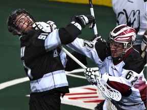Cory Conway, then with the Edmonton Rush, takes a shot to the chops from the Colorado Mammoth’s Creighton Reid during a Feb. 15, 2015 National Lacrosse League game in Edmonton. Conway has signed a free-agent deal with the NLL’s Vancouver Stealth on Monday.