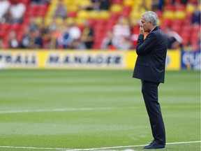 Manchester United's Portuguese manager Jose Mourinho looks on before the English Premier League football match between Watford and Manchester United at Vicarage Road Stadium in Watford, north of London on September 18, 2016. /