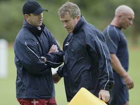 MANCHESTER - JULY 23:  England Coach, Joe Lydon and assistant, Damian McGrath talk tactics during the England Rugby Sevens training session at Ald Winnians RFC in Audenshaw, Manchester on July 23, 2002 ahead of the Commonwealth Games which commence on July 25. (Photo by Alex Livesey/Getty Images)