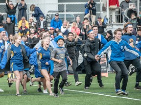 Jubilant Handsworth Royals football fans flood the field at Carson Graham on Saturday after their Royals topped the host Eagles in Buchanan Bowl XXX. (Blair Shier photo)