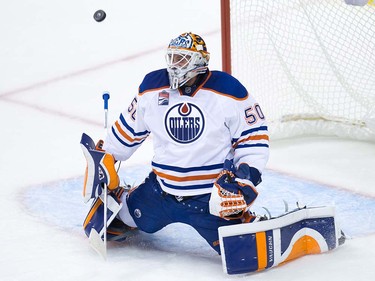 Edmonton Oilers' goalie Jonas Gustavsson, of Sweden, makes a save against the Vancouver Canucks during the second period of a pre-season NHL hockey game in Vancouver, B.C., on Wednesday September 28, 2016.