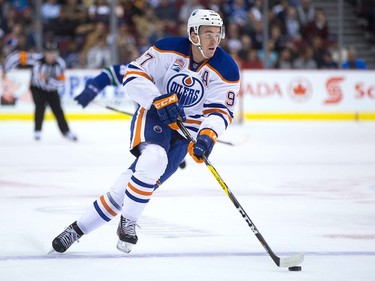 Edmonton Oilers' Connor McDavid skates with the puck during the first period of a pre-season NHL hockey game against the Vancouver Canucks in Vancouver, B.C., on Wednesday September 28, 2016.