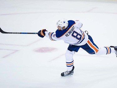 Edmonton Oilers' Griffin Reinhart follows through on a shot that resulted in a goal against the Vancouver Canucks during the second period of a pre-season NHL hockey game in Vancouver, B.C., on Wednesday September 28, 2016.