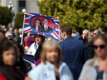 Hundreds of people wait to greet the Duke and Duchess of Cambridge before their arrival at the B.C. Legislature in Victoria, B.C., Saturday, Sept 24, 2016.