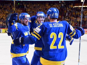 In this file photo, the Sedins and Loui Eriksson celebrate a goal in 2013. They scored a goal on Thursday, but no images were available. Enjoy!