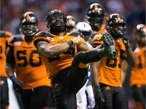 B.C. Lions' Jeremiah Johnson, centre, celebrates his touchdown against the Montreal Alouettes during the first half of Friday's game at B.C. Place.