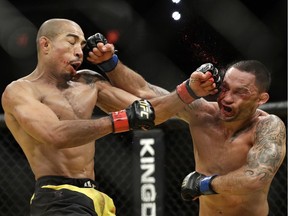 Jose Aldo, left, and Frankie Edgar trade blows during their featherweight championship mixed martial arts bout at July's UFC 200 in Las Vegas. Aldo has asked for his release from the UFC, frustrated over the promotion's refusal to schedule a rematch with Conor MacGregor, who Aldo says is the real decision-maker for the UFC.