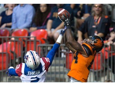 B.C. Lions' Emmanuel Arceneaux, right, makes a reception in the end zone for a touchdown as Montreal Alouettes' Jovon Johnson defends during the first half of a CFL football game in Vancouver, B.C., on Friday September 9, 2016.