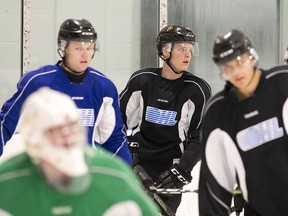 Olli Juolevi (centre) was skating with his London Knights teammates a week ago, but this weekend he's in Penticton with the Canucks YoungStars.