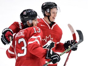 Canada's Mathew Barzal, left, celebrates his team's win over Switzerland with teammate Thomas Chabot at the IIHF World Junior Championship in Helsinki in December 2015. Does the Seattle Thunderbirds get centre Barzal, 19, back from the New York Islanders this season?