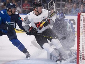 Nothing like a snow shower to remind a goalie that summer is over. Connor McDavid sprays Jaroslav Halak during Thursday's exhibition between Team North America and Team Europe.