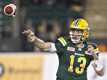 Edmonton Eskimos quarterback Mike Reilly (13) makes a throw against the B.C. Lions during first half CFL action in Edmonton, Alta., on Friday September 23, 2016.