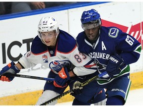 Vancouver Canucks' Jordan Subban (67) has his eye on the puck next to  Edmonton Oilers' Matt Benning (83) during first period 2016 NHL Young Stars Classic action at the South Okanagan Events Centre in Penticton, BC., September 16, 2016.