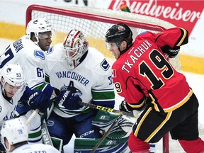 Vancouver Canucks' Jordan Subban (67) in front of the net with Calgary Flames' Matthew Tkachuk (19) during second period 2016 NHL Young Stars Classic action at the South Okanagan Events Centre in Penticton.