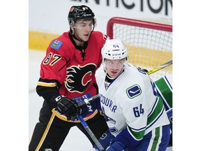The Vancouver Canucks re-assigned Tate Olson, right, to the Prince George Cougars on Monday.