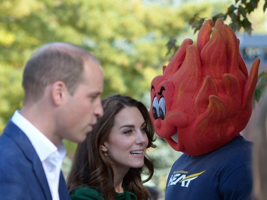 The Duke and Duchess of Cambridge are greeted by a school mascot at an event at the University of British Columbia's Okanagan campus in Kelowna, B.C., Tuesday, Sept. 27, 2016.