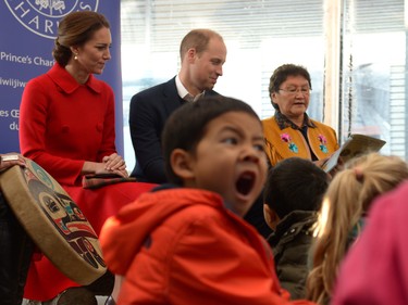 A young boy yawns as Prince William and his wife Kate, the Duke and Duchess of Cambridge attend story time at the MacBride Museum of Yukon History in Whitehorse, Yukon, Wednesday, Sept. 28, 2016.
