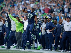 A scary moment for the Seahawks: Miami Dolphins defensive tackle Ndamukong Suh steps on Seattle quarterback Russell Wilson's foot in the third quarter Sunday.