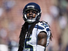 In this Sunday, Sept. 18, 2016, photo, Seattle Seahawks cornerback Richard Sherman (25) warms up prior to an NFL football game against the Los Angeles Rams at the Los Angeles Memorial Coliseum in Los Angeles. Sherman said Wednesday the public isn't listening to the message NFL players are trying to send with their actions during the national anthem.