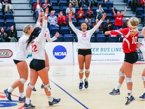Simon Fraser setter Tamara Nipp celebrates a point on the court with her Clan teammates. SFU is set open conference play Wednesday at home to Western Washington. (Ron Hole/SFU athletics) [PNG Merlin Archive]