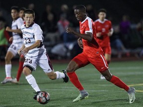 Simon Fraser's Mamadi Camara (right) makes his way past Seattle Pacific's Jordan Kollars during Great Northwest Athletic Conference opener for both teams last Thursday at SFU. (Ron Hole/SFU athletics) [PNG Merlin Archive]