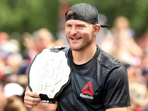 CLEVELAND, OH - JUNE 22:  UFC heavyweight champion Stipe Miocic looks on during the Cleveland Cavaliers 2016 NBA Championship victory parade and rally on June 22, 2016 in Cleveland, Ohio.