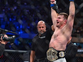 May 14, 2016; Curitiba, Brazil; Stipe Miocic (blue) reacts after defeating Fabricio Werdum (not pictured) during UFC 198 Fight Night at Arena Atletico Paranaense.