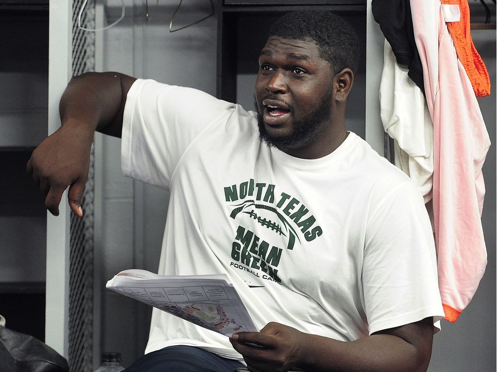 SURREY, BC., May 25, 2016 -- Antonio Johnson of the BC Lions talks to media before heading to training camp, in Surrey, BC., May 25, 2016. (Nick Procaylo/PNG) 00043380A [PNG Merlin Archive]