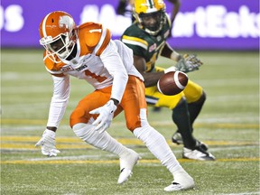 B.C. Lions' Terrell Sinkfield Jr. (1) misses the catch against the Edmonton Eskimos during first half CFL action in Edmonton, Alta., on Friday.