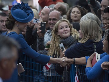 The Duchess of Cambridge greets people as she leaves the British Columbia legislature in Victoria, B.C., Saturday, Sept 24, 2016.