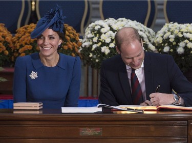 The Duke and Duchess of Cambridge sign the Canadian government's Golden Book at the Legislative Assembly in Victoria, B.C., on Saturday, September 24, 2016.