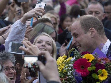 The Duke of Cambridge greets onlookers as he leaves the Legislative Assembly in Victoria, B.C., Saturday, Sept 24, 2016.