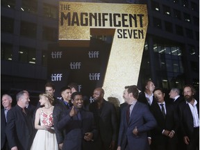 The Magnificent 7 cast including Denzel Washington, Chris Pratt, Ethan Hawke, and Vincent D'Onofrio walk on the red carpet at Roy Thomson Hall on the first day of the Toronto International Film Festival in Toronto.