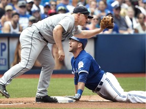 Blue Jays Josh Thole is safe at third as Seattle Mariners Kyle Seager is late with the tag during their American League game in Toronto on July 24. Starting Monday, the Jays and Mariners meet in a pivotal three-game series.