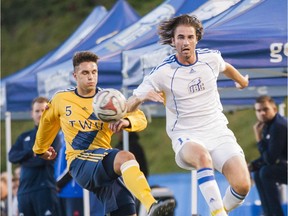 Trinity Western's Vaggeli Boucas (left) and Liam McManaman of the UBC Thunderbirds battle for possession Friday during matchup of nationally-ranked teams. After a scoreless first half, UBC caught fire to win 3-0. [Wilson Wong, UBC athletics]