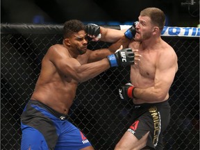 Stipe Miocic punches Alistair Overeem during his UFC 203 win at Quicken Loans Arena last week in Cleveland. Miocic is the defending heavyweight champion, but even he was overshadowed by the CM Punk hype machine.