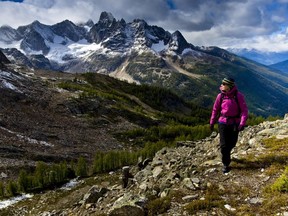 A woman hikes in the Bugaboo Mountains wearing Arc'teryx gear manufactured in B.C.