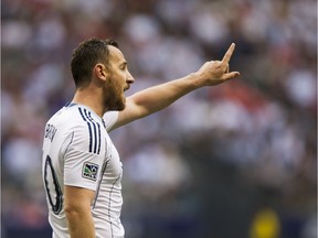 Andy O'Brien was a stable presence in central defence for the Vancouver Whitecaps when he played here. Here he gestures to teammates during an August 2013 Major League Soccer game at B.C. Place.