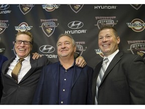 New head coach Jason McKee, right, was added to the Vancouver Giants' overhauled look in June. Owner Ron Toigo, centre, also hired Glen Hanlon to be the new GM.