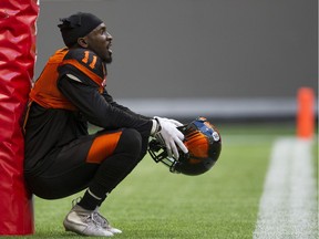 B.C. Lions safety Mike Edem takes a quick break during the pre-game warmup earlier this season at B.C. Place Stadium.